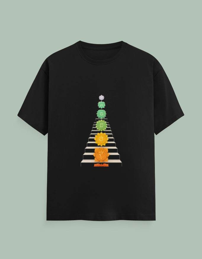 Black Moksha Chakra Yoga Tee with colorful chakra symbols aligned vertically on front