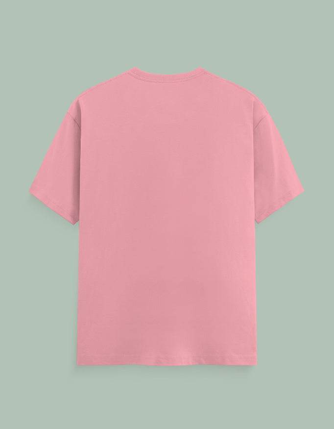 Back view of plain pink SkyBi Shirts Chakra Dancer t-shirt with short sleeves on green background