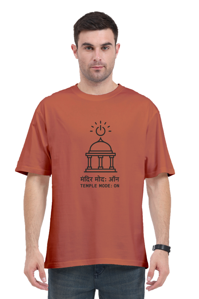 Man wearing rust-colored oversized t-shirt 240 GSM with black temple graphic and text in English and Hindi